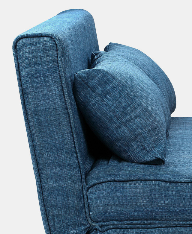 The side angle shows the furniture in a sofa position, with the small but plump cushions neatly arranged.