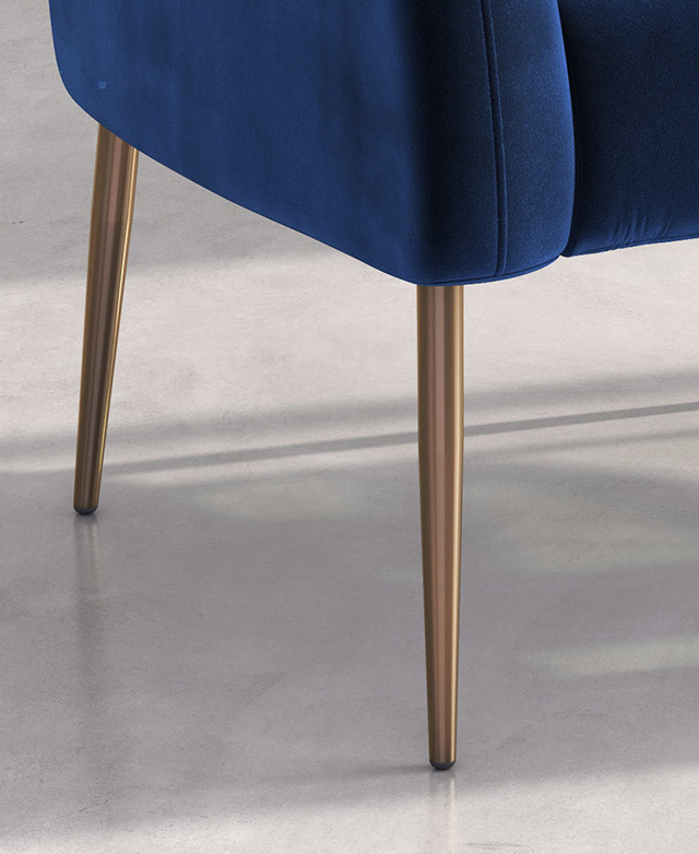 Two of the four slender, tapered, brushed metal legs are shown close up.