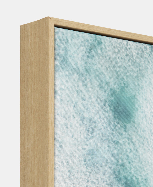 Coastal wall art that's comprised of a cotton-polyester canvas and a timber-look outer frame.