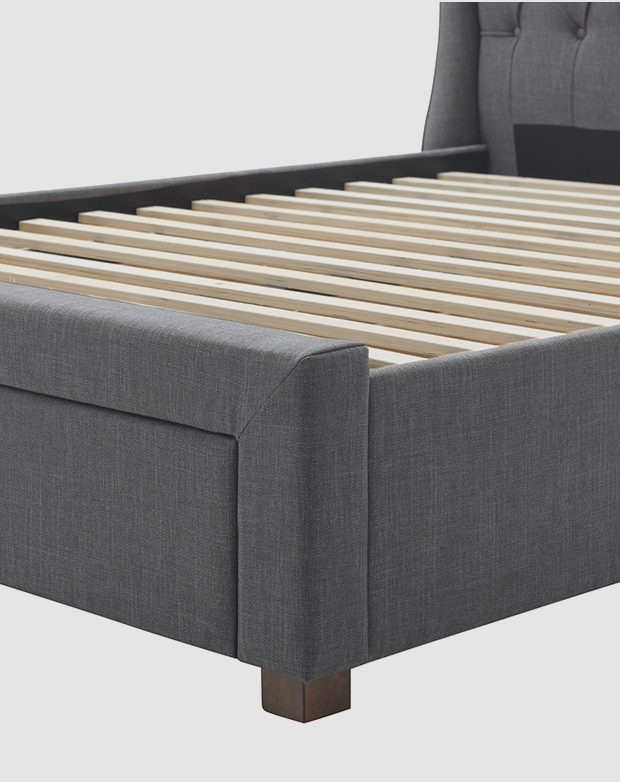 From a front angle, the upholstered base frames the slat support.