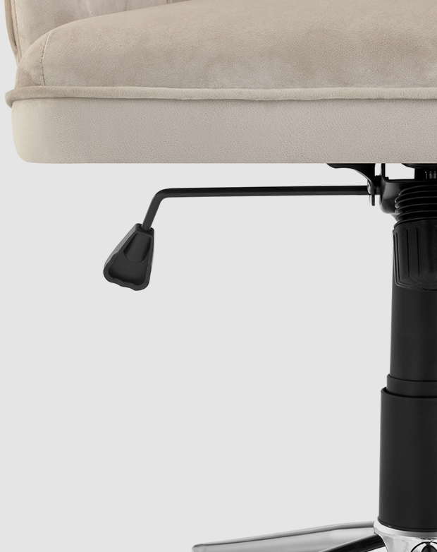 A functional gas lift lever projects out from underneath the seat of an office chair.