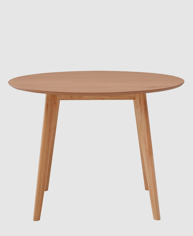 The full dining table is shown from one side, where the rounded edge, and rubberwood legs and apron framed. The full dining table is shown from one side, where the rounded edge, and rubberwood legs and apron framed.