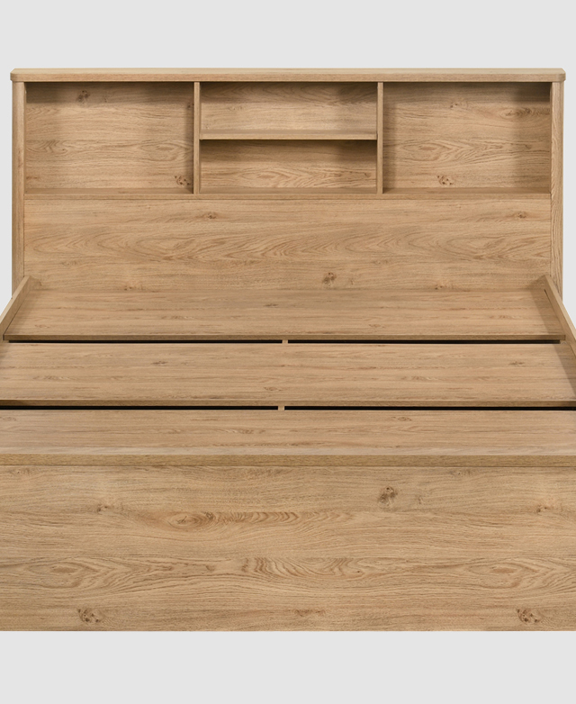 Front-on view of a particle board bed frame with a light timber appearance. Four shelves are built into the bedhead. Front-on view of a particle board bed frame with a light timber appearance. Four shelves are built into the bedhead.