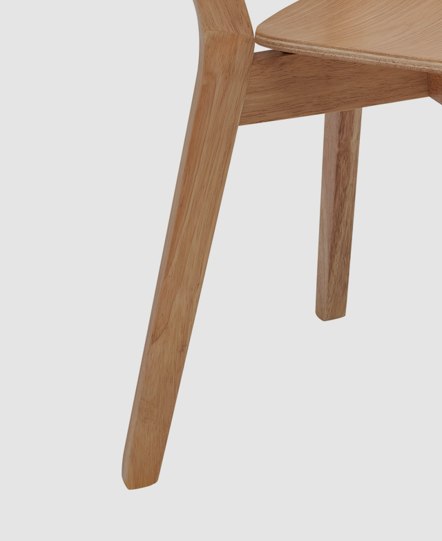 The full length of one of the legs makes clear the tapered, angular shape, and the rubberwood's natural grains. The full length of one of the legs makes clear the tapered, angular shape, and the rubberwood's natural grains.