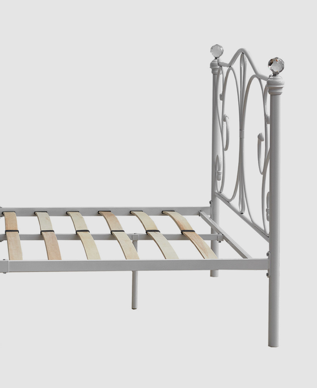 Evenly spaced wooden slats are affixed along the base of the bed frame. Evenly spaced wooden slats are affixed along the base of the bed frame.