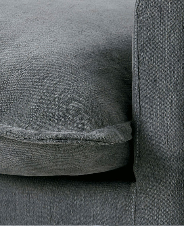 The base cushion of the armchair is in focus, with soft cotton-blend upholstery and a stylish flange trim. The base cushion of the armchair is in focus, with soft cotton-blend upholstery and a stylish flange trim.