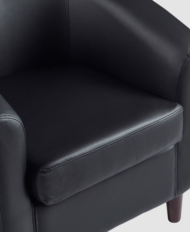 The glossy sheen and smooth texture of the polyurethane leather upholstery is shown.