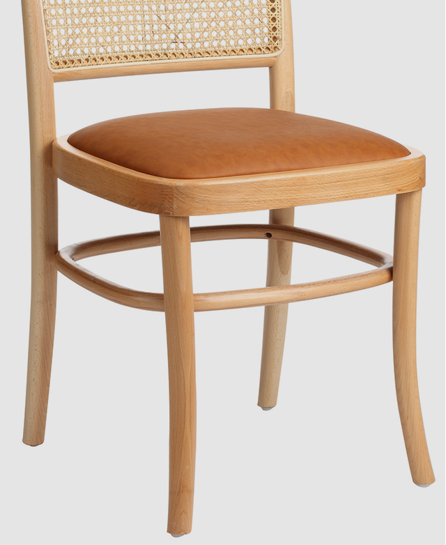 The chair frame features attractive bentwood details and an interior ring for additional support.