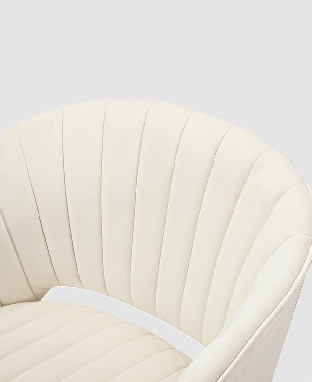 A top angle view showcases the textured panelling of the creamy-white upholstery.