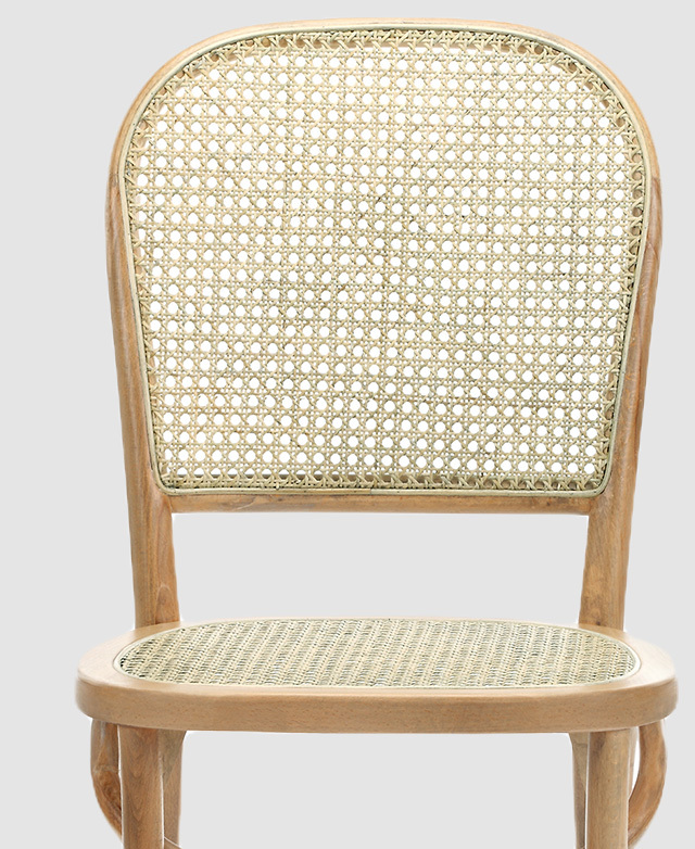 A chair is shown front-facing and close up, with its rounded modern features centre stage.