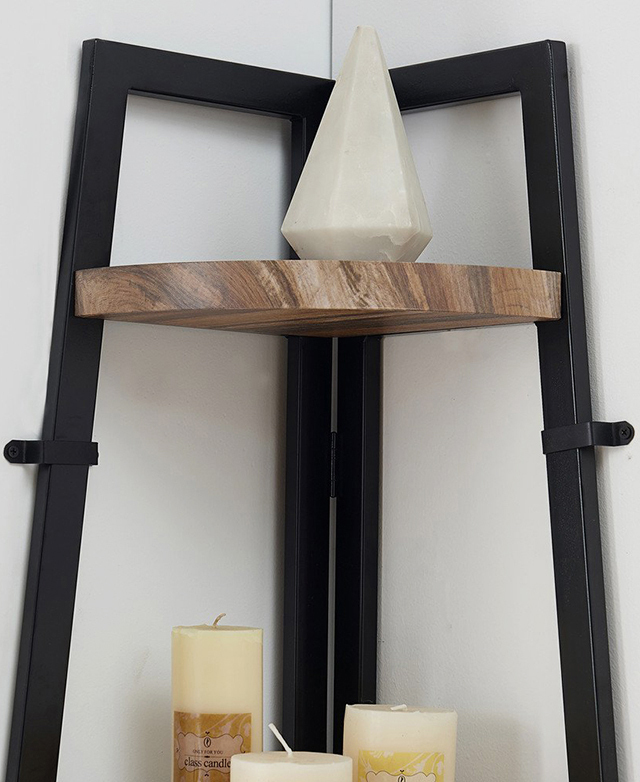 A prism-like marble object is on the top shelf, and candles are positioned on the second shelf. A prism-like marble object is on the top shelf, and candles are positioned on the second shelf.