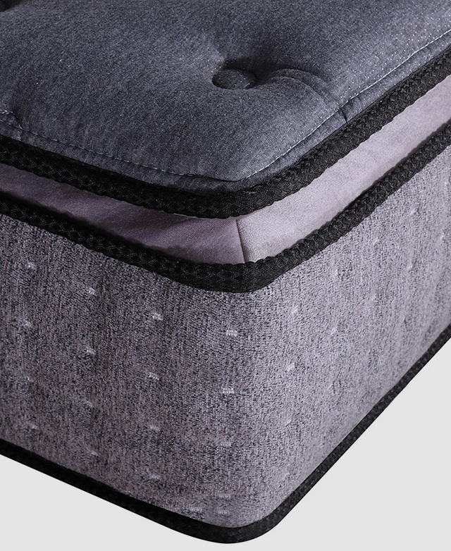 A three-quarter close-up image displays the piped corner, the mattress depth, and the knitted fabric.