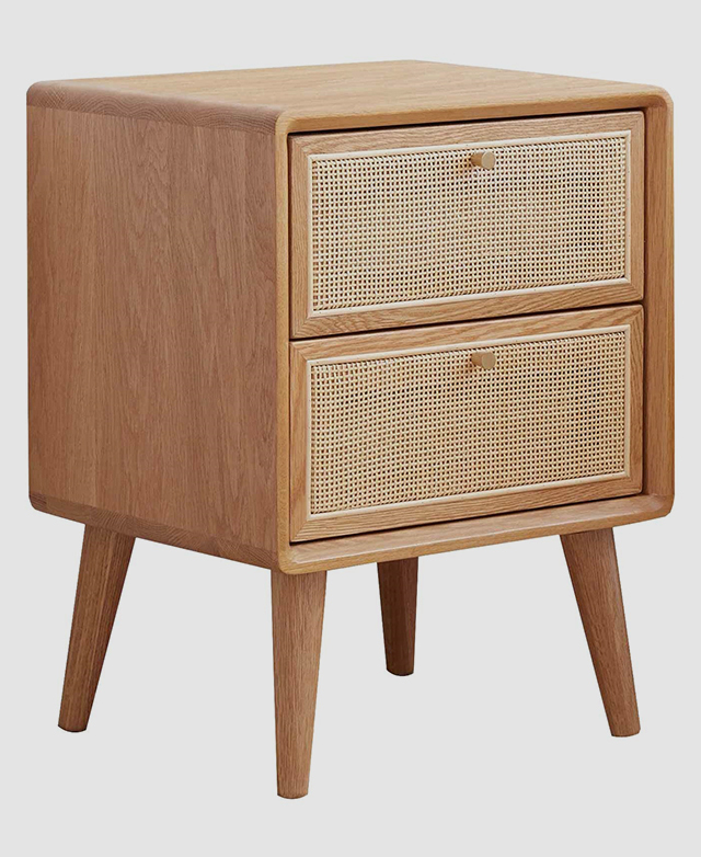 The entire side table is shown, emphasising its chic rattan texture and warm solid oak wood grain. The entire side table is shown, emphasising its chic rattan texture and warm solid oak wood grain.