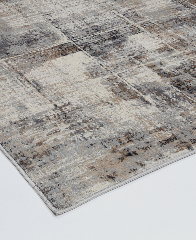 The 0.8cm pile height and thick grey-toned binding around the perimeter of the rug are shown up close.