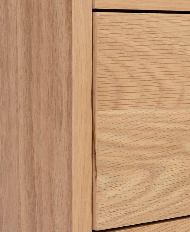 Close-up of the MDF body, with a light blonde oak veneer finish featuring a timber-look texture.