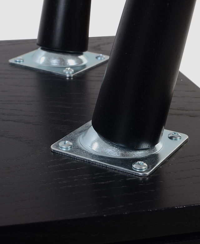 Large-scale view of the leg fixtures attached to the base of the side table by screws.