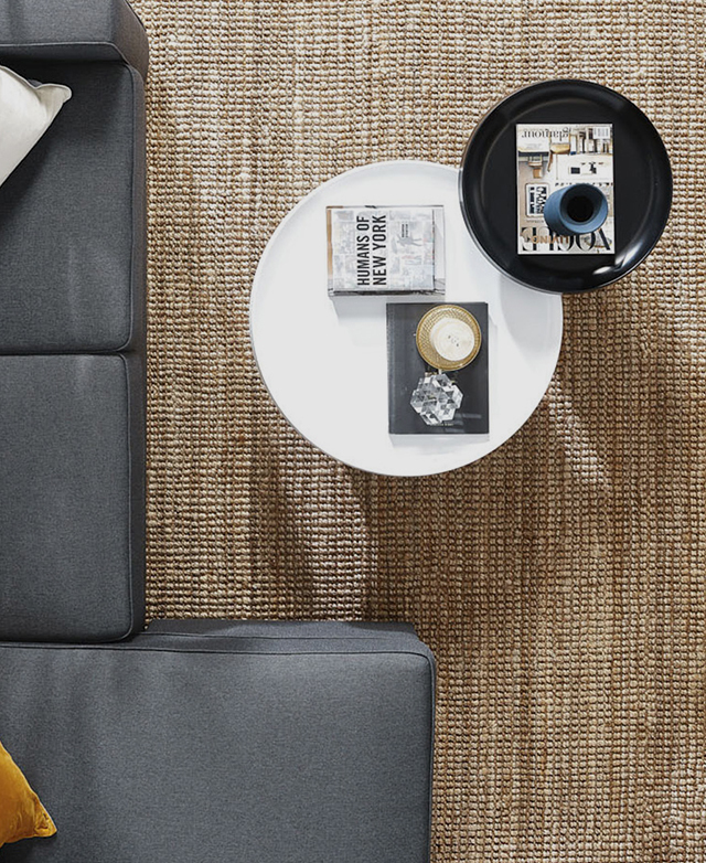 A bird's-eye view of the table in a living room setting shows its accommodating height and utilitarian purpose.