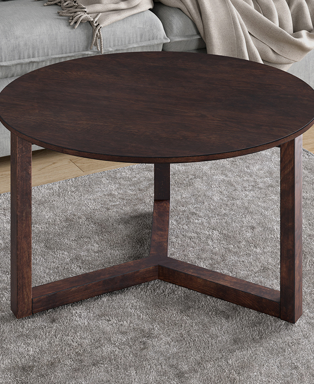 The walnut-colour coffee table is positioned on a grey rug in front of a grey sofa. The walnut-colour coffee table is positioned on a grey rug in front of a grey sofa.