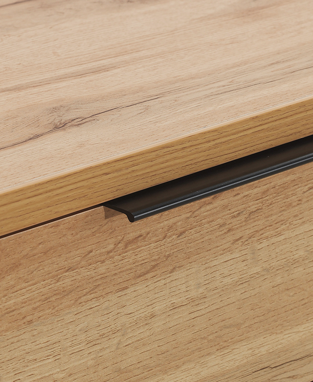 The top edge is in focus, showing the grains, the smooth finish, and the sleek, flat, black metal handle.