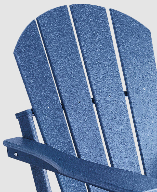 The cropped image shows a long, smooth armrest and the slatted backrest and its arc top.