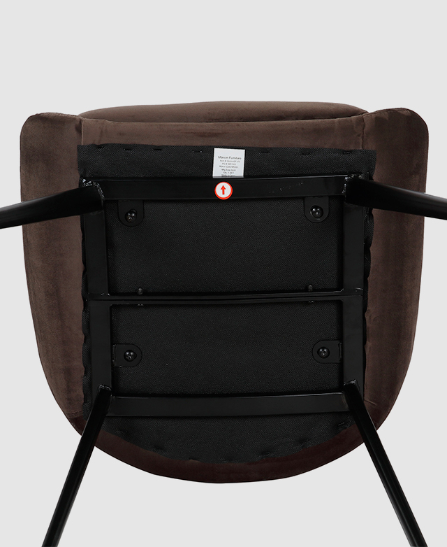 The underside of the chair highlights the welded metal details.