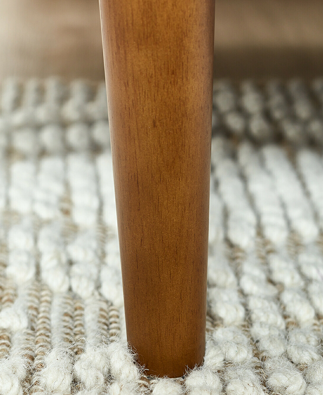 Large-scale view of one rubberwood leg. The tapered shape and veins are clearly visible.