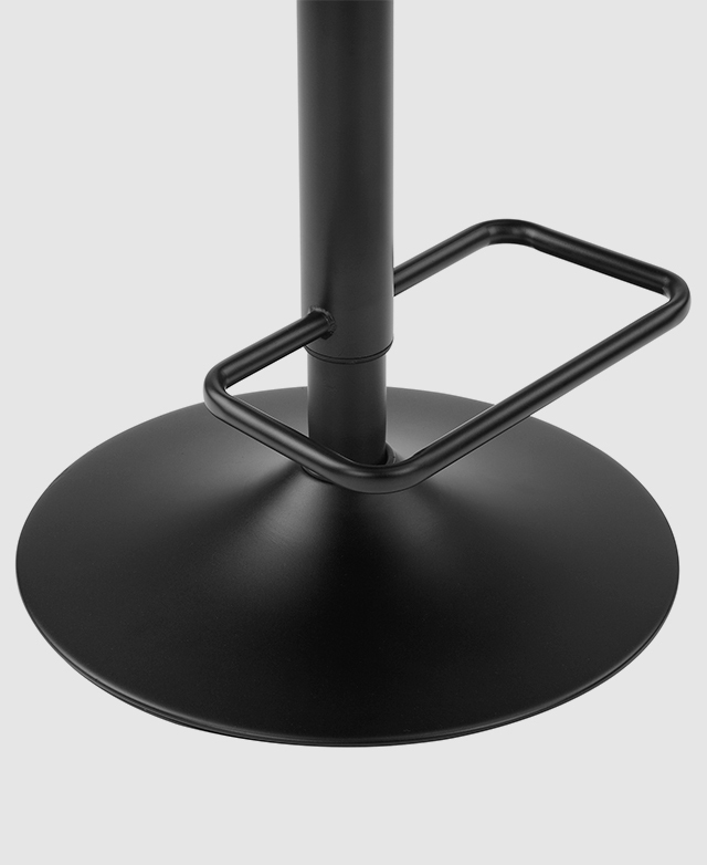 Focus is on the black, metal footrest, which is a squared shape with rounded corners.