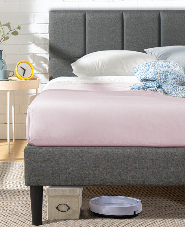 A front view depicts the clean lines of the bed frame in a bedroom setting to demonstrate its ease of styling. A front view depicts the clean lines of the bed frame in a bedroom setting to demonstrate its ease of styling.