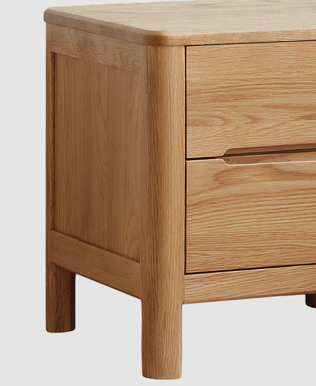 An end shows a panel border, while a rounded corner is the focus of the bedside table.