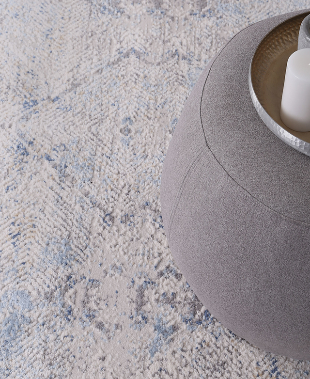 A polypropylene rug with a high-low pile and geometric pattern. A polypropylene rug with a high-low pile and geometric pattern.