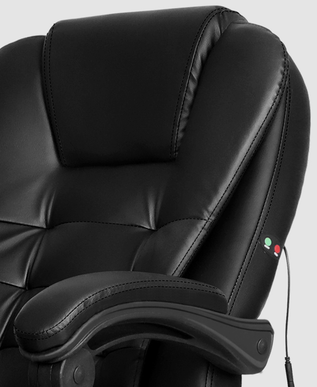 The backrest of an executive office chair is in focus, highlighting the densely padded faux leather upholstery. The backrest of an executive office chair is in focus, highlighting the densely padded faux leather upholstery.