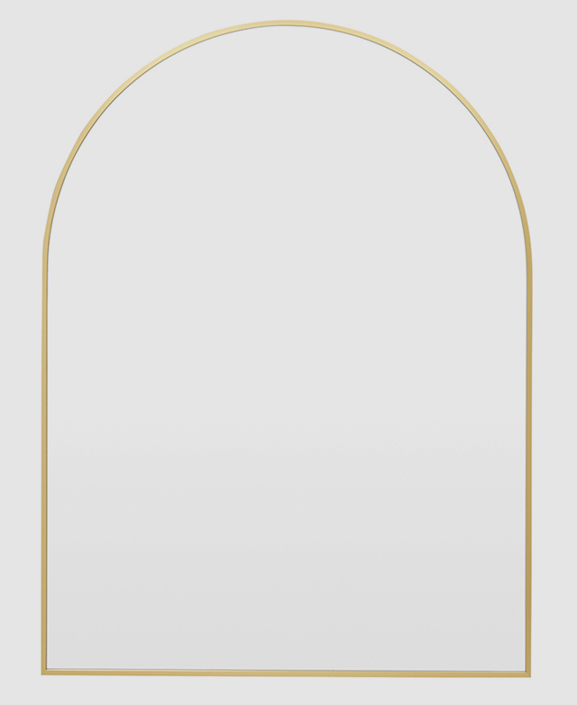 An arched mirror with a slim aluminium frame in a golden finish. An arched mirror with a slim aluminium frame in a golden finish.