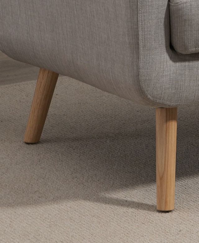 Rubberwood legs lift the armchair off of the floor, and feature adjustable leg pads underneath. Rubberwood legs lift the armchair off of the floor, and feature adjustable leg pads underneath.