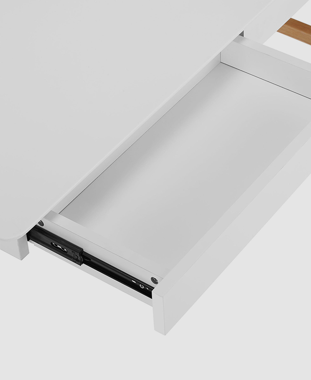 One of the drawers is pulled open so that the depth can be seen, and a black metal runner is visible. One of the drawers is pulled open so that the depth can be seen, and a black metal runner is visible.