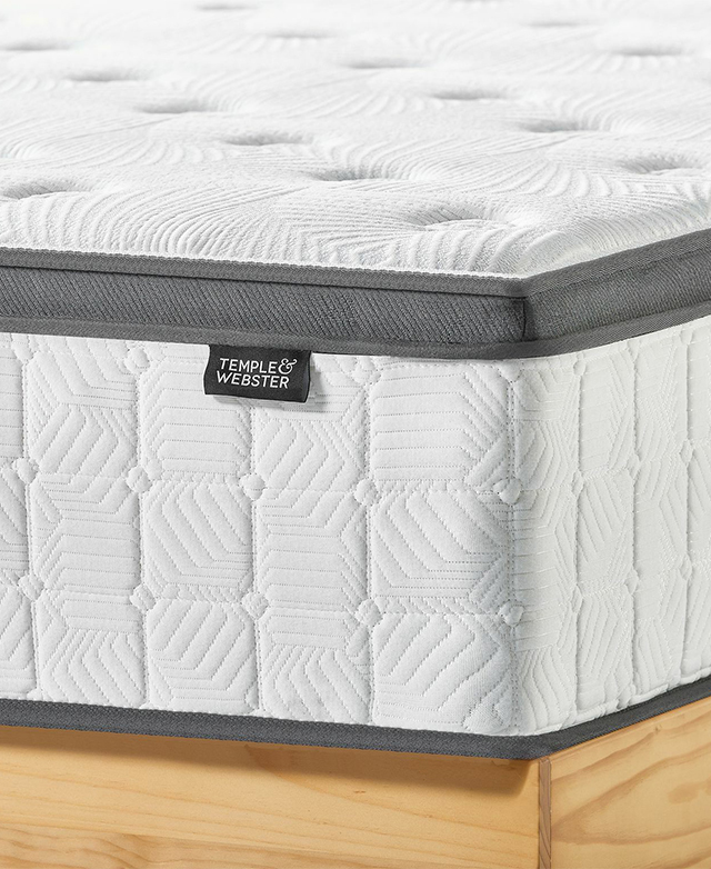 A corner angle displays the mattress up close. The contrasting grey trims and the Temple & Webster label are the focus.