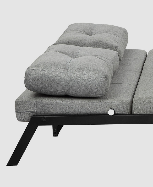 The sofa bed is in a reclined position, with the two plump cushions arranged neatly at the top section. The sofa bed is in a reclined position, with the two plump cushions arranged neatly at the top section.