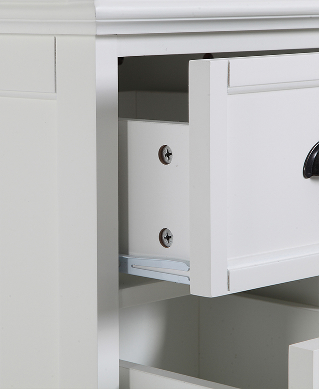An angled close up highlights a metal drawer runner of a partially opened top drawer.