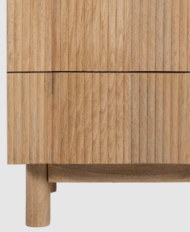 Close-up highlighting the shallow groove detail on the drawer fronts, creating a fluting texture.