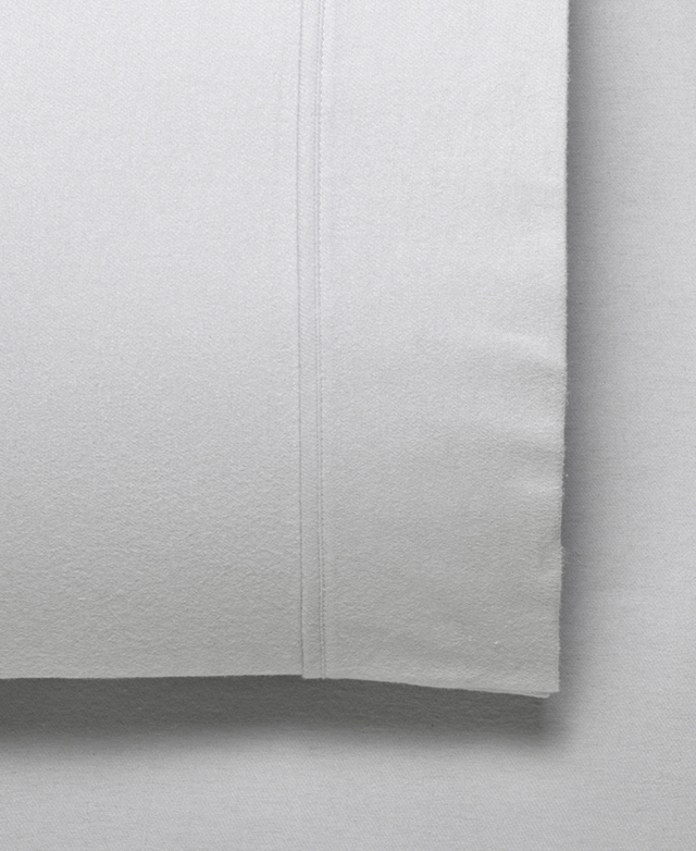 Close view of the flannelette pillowcase. It has a subtle fleecy texture and neat cuffed trim. Close view of the flannelette pillowcase. It has a subtle fleecy texture and neat cuffed trim.