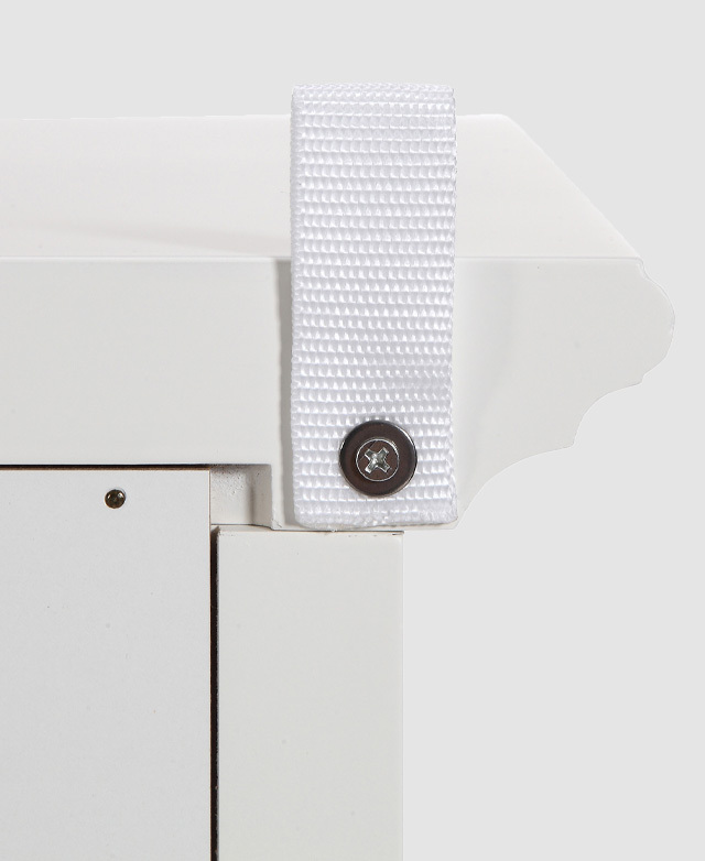 From a back angle, the outline of the bevelling is displayed next to one of the the included safety straps.