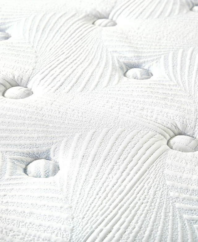 The close-up image shows the button tufting and knitted fabric in detail.