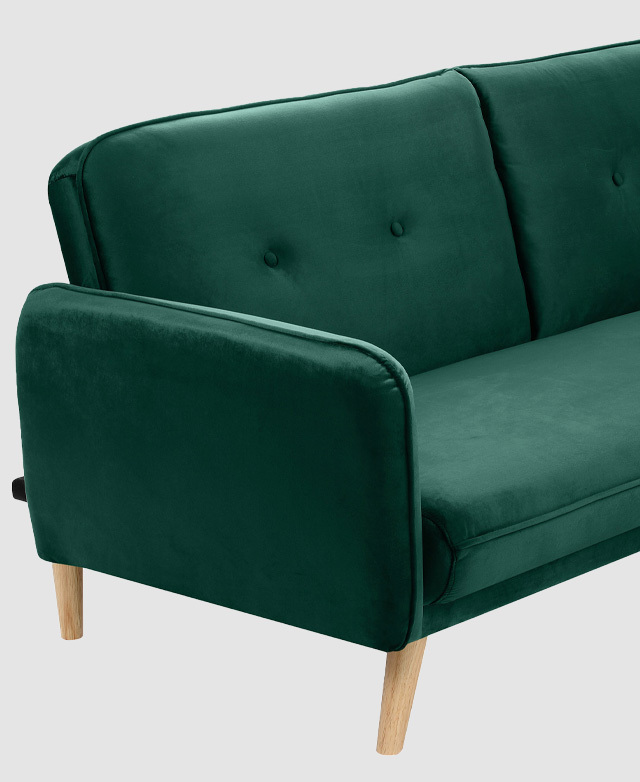 Shown is one slender armrest, part of the smooth seat, and the backrest, which is button tufted.