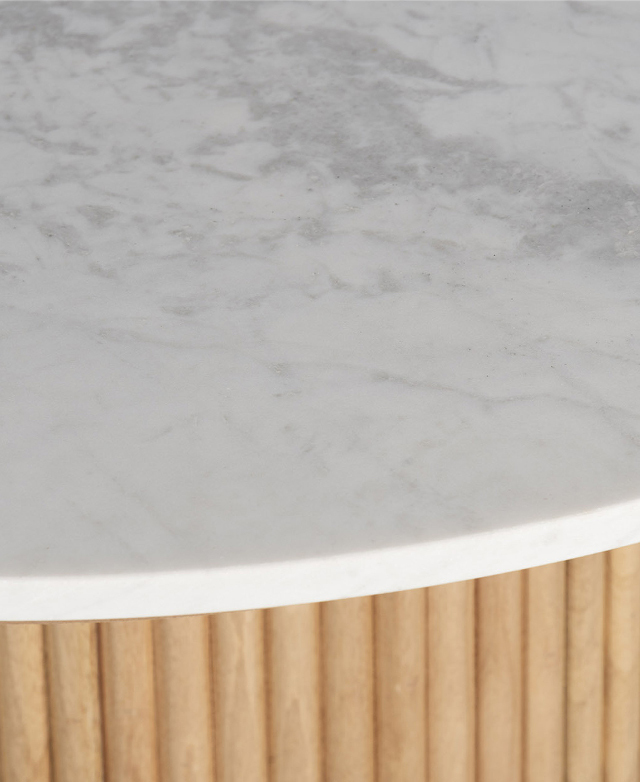 Close-up of the real marble table top. It is white with natural grey veins.