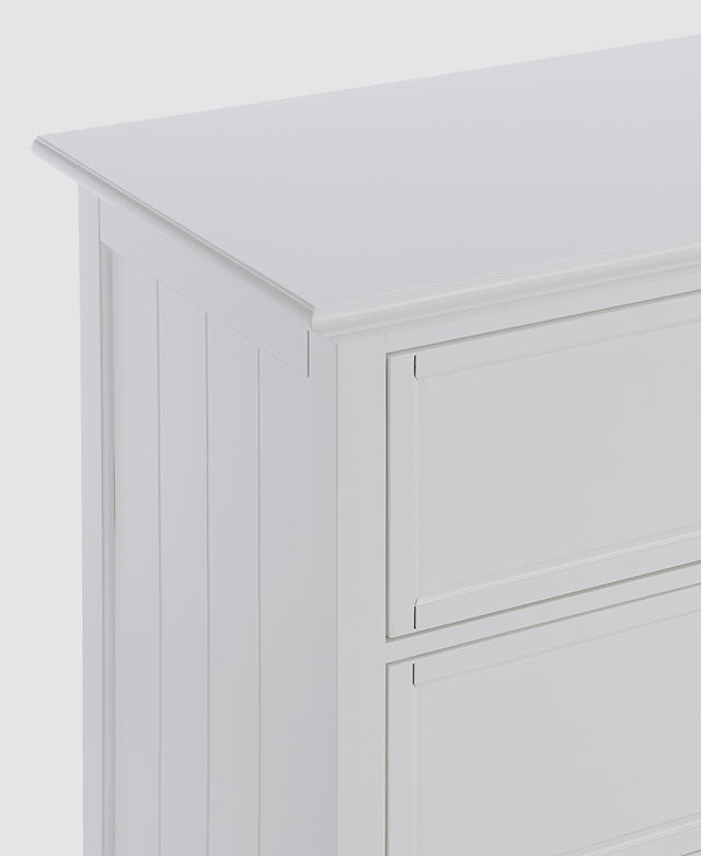 A three-quarter angle shows the panelled end, as well as the bevelling around the top edges. A three-quarter angle shows the panelled end, as well as the bevelling around the top edges.