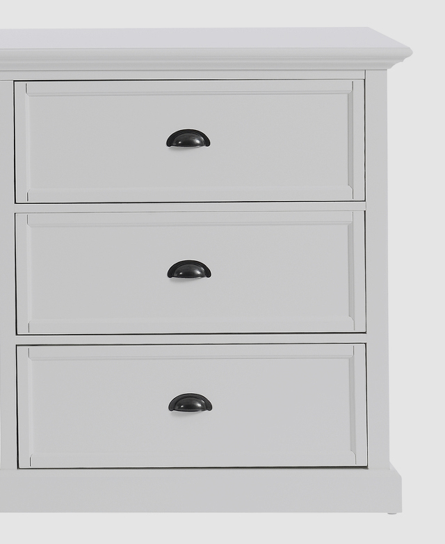 One side of the chest of drawers is pictured front-facing. All drawers are closed, and all neat metal handles are shown. One side of the chest of drawers is pictured front-facing. All drawers are closed, and all neat metal handles are shown.