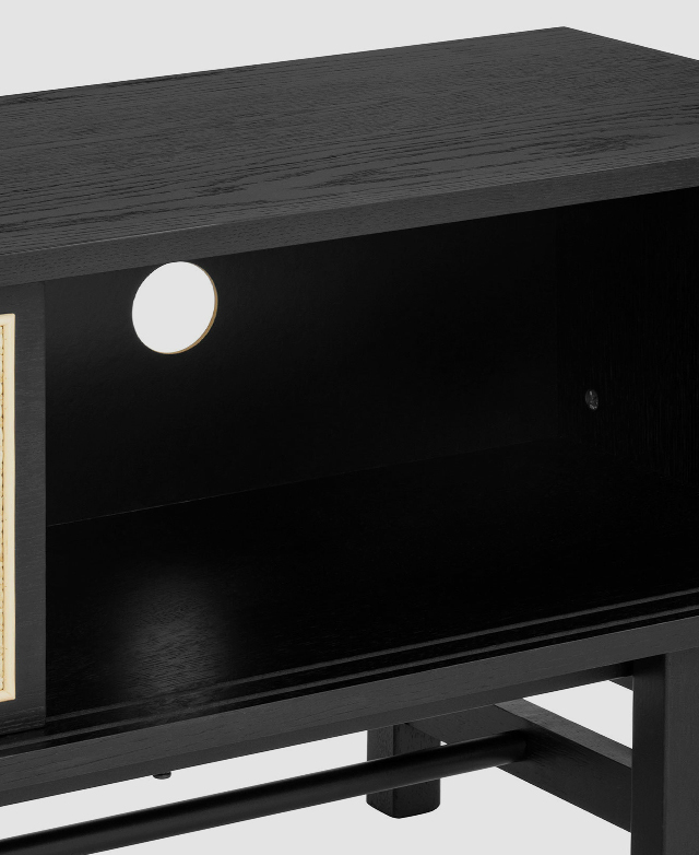 TV unit with an open sliding door, revealing its spacious storage and cable hole cut-out on the back. TV unit with an open sliding door, revealing its spacious storage and cable hole cut-out on the back.