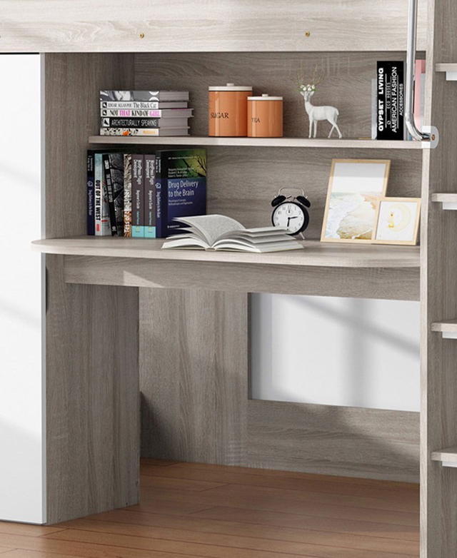 A desk is situated in the centre of the bed frame. Studious items are arranged on the spacious table top and included shelf. A desk is situated in the centre of the bed frame. Studious items are arranged on the spacious table top and included shelf.