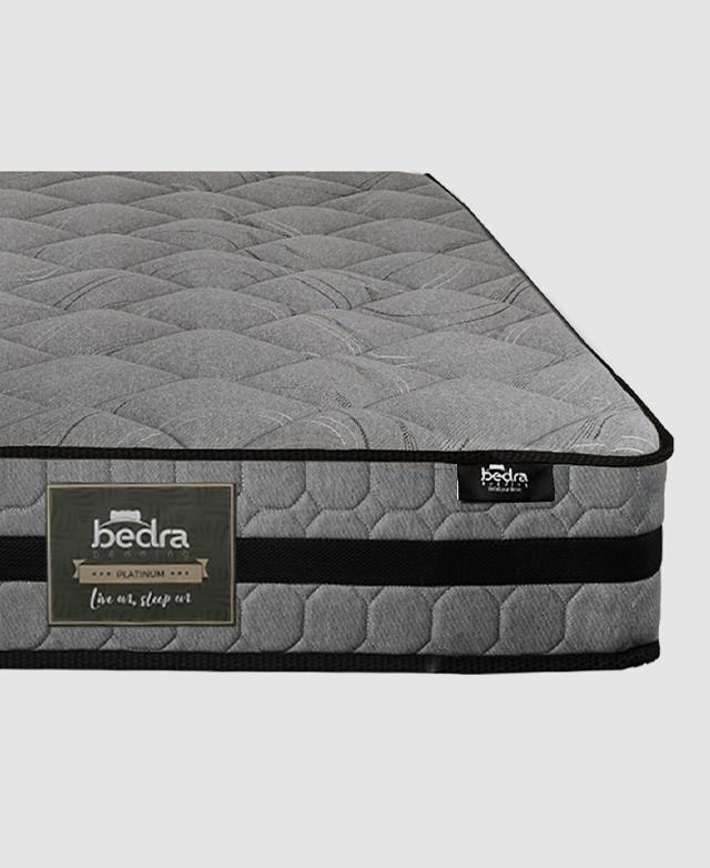 Front view of the rectangular mattress with a thick black band and hexagonal stitching around the border.