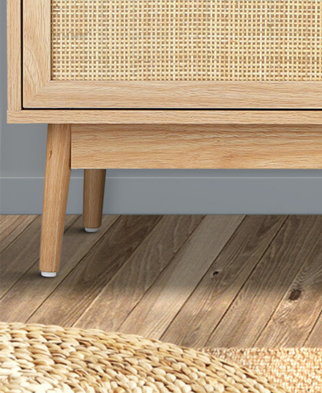 The foot protectors of the tapered, cylindrical legs are highlighted from a low-to-the ground angle.