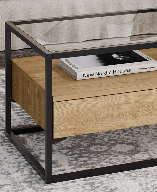 One end is displayed at an angle on a grey patterned rug. A 'New Nordic Houses' book is on the shelf. One end is displayed at an angle on a grey patterned rug. A 'New Nordic Houses' book is on the shelf.